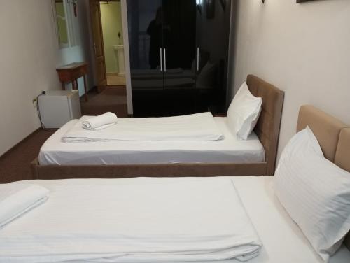 Ένα ή περισσότερα κρεβάτια σε δωμάτιο στο RHC Royal Hotel