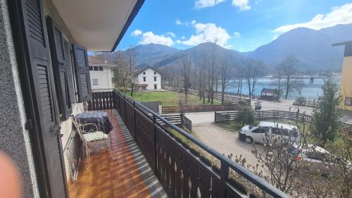 a balcony with a view of a lake and mountains at Bioledro - Casa Lena in Mezzolago