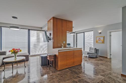 a kitchen and living room with a couch and a table at Villa Ambra in Tyulenovo