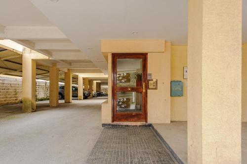 an empty hallway with a door in a building at Gray Fox Apartments - Roca in Ushuaia