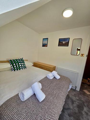 Ένα ή περισσότερα κρεβάτια σε δωμάτιο στο Aldourie Guest House