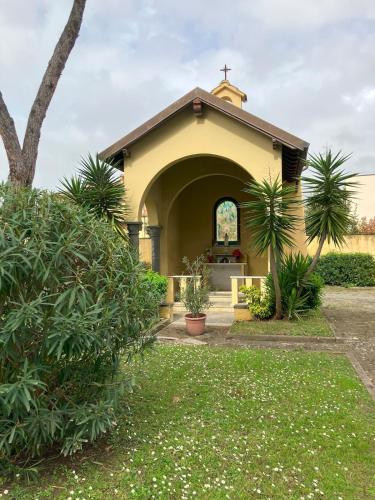 a church with a cross on the front of it at Relax between the sea and the mountains in Cinquale