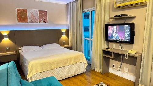 TV a/nebo společenská místnost v ubytování HOTEL PERDIZES - FLAT Executivo - 404