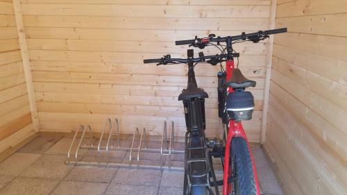 a bike parked in a corner of a room at Village Premium Apartment by Český Krumlov - adults only in Střížov