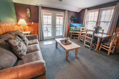 a living room with a couch and a table at Lawn Lane B - #3383 in Estes Park