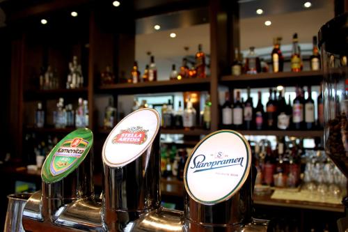 a bar with two bottles of beer on a counter at Park Hotel and SPA Vella Hills in Velingrad