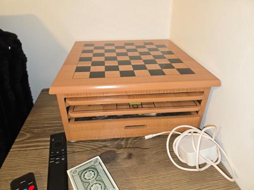 a chess board on top of a drawer with a chessboard at The Happy Place in Glouster