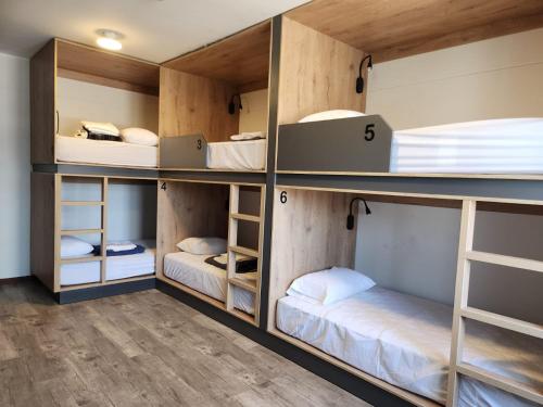 a room with four bunk beds in it at Alojamiento San Francisco - Apartamentos y habitaciones in Lima