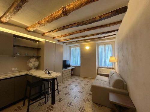 a living room with a couch and a table at Hotel Ariston & Apartments in Varazze
