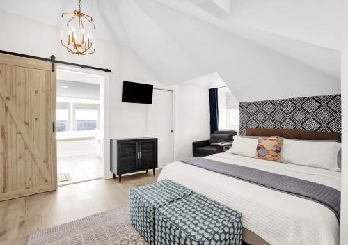 a bedroom with a large bed and a fireplace at Walk to Memphis Nightlife, 100 Yr Old Cozy Apt in Memphis