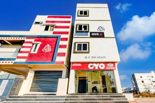 a building with a sign on the side of it at SPOT ON Hari Hara Enterprises in Maula Ali