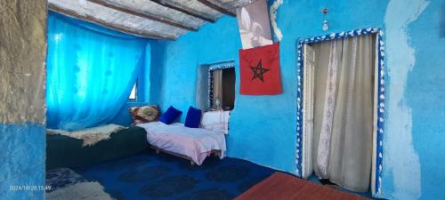 Postel nebo postele na pokoji v ubytování Maison d'hotes oued el Makhazine chez Bilal