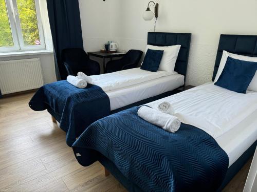 Postel nebo postele na pokoji v ubytování Apartments Iris-Topolowa