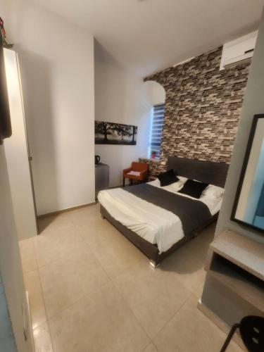 Postel nebo postele na pokoji v ubytování Ben Hillel Boutique Hotel