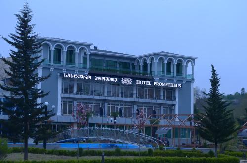 a large building with a sign on it at Tskaltubo Hotel Prometheus in Tskaltubo