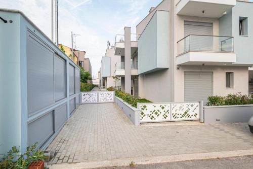 an empty walkway in front of a building at Elymara Family Vacation Home in Nikiti