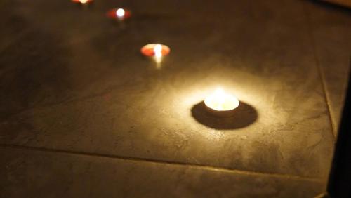 a candle sitting on top of a table at Hébergement lux dakhla in Dakhla