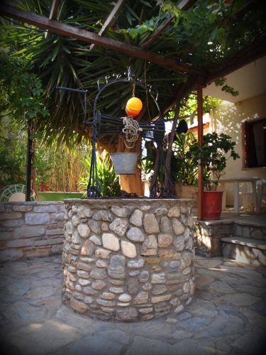 a stone wall with a light on top of it at Andromahi Studios in Lefokastro