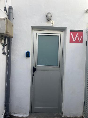 a door on the side of a white building at Casa ADOLFO in Almáciga