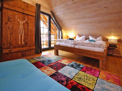 a bedroom with a bed in a log cabin at Ferienhaus, Schierke in Schierke
