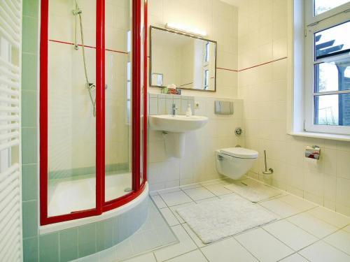a bathroom with a toilet and a sink at Wohnung in Zahrensdorf bei drei Seen in Zahrensdorf