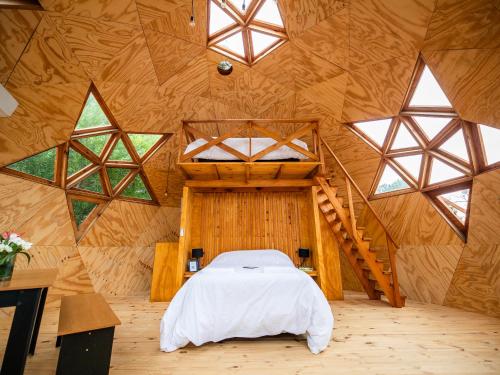 Postel nebo postele na pokoji v ubytování Ocean Domes