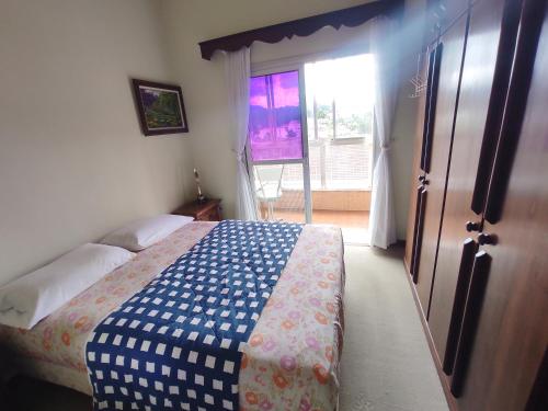 Ένα ή περισσότερα κρεβάτια σε δωμάτιο στο Apartamento no Alto com vaga
