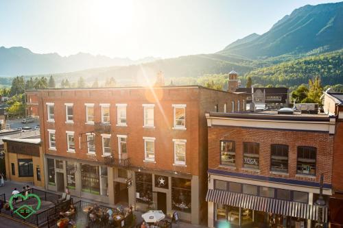 a view of a town with a mountain in the background at Downtown Loft with Rooftop Hot Tub by StayIn in Fernie
