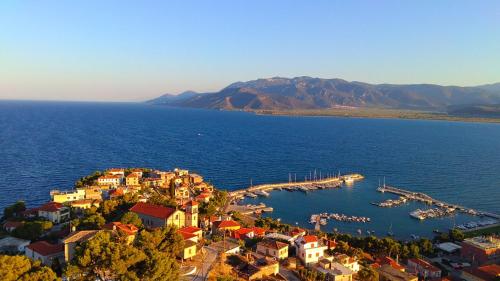 an aerial view of a small town on a body of water at Oneiro Paralio Astros Nisi in Paralion astros