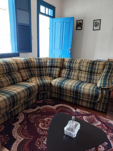 a living room with a couch and a table at Pousada São Matheus- Lauro Müller-SC in Louro Müller