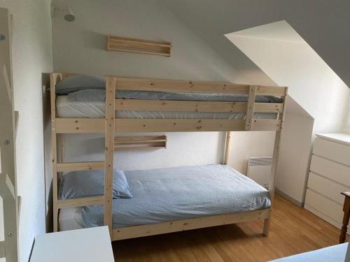 Ένα ή περισσότερα κρεβάτια σε δωμάτιο στο Appartement dans une résidence avec piscines