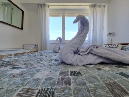 Una cama o camas en una habitación de Miramar Todo el Año