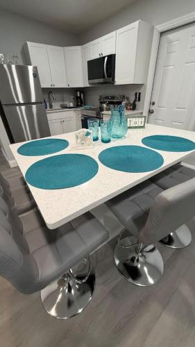 a kitchen with a counter top with blue accents at Dolphin Cove 1 block from the Beach in Cocoa Beach