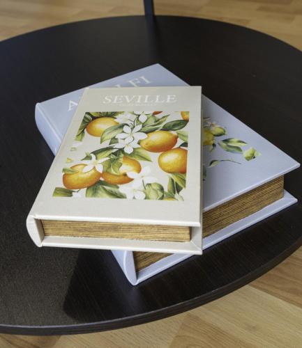 two books stacked on top of each other on a table at Riverview House in Glasgow