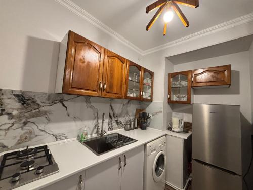 a kitchen with a sink and a refrigerator at GUEST HOUSE IN Dilijan MD GUEST HOUSE in Dilijan