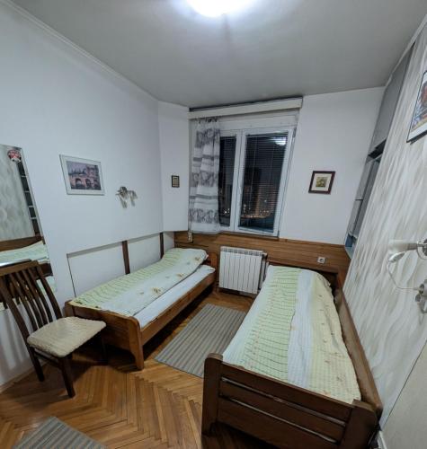 Postelja oz. postelje v sobi nastanitve Stan Uzice