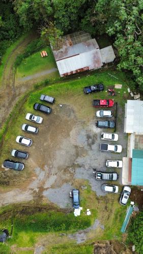 an aerial view of a parking lot with parked cars at Pozas y Cascadas La Presa in Río Cuarto
