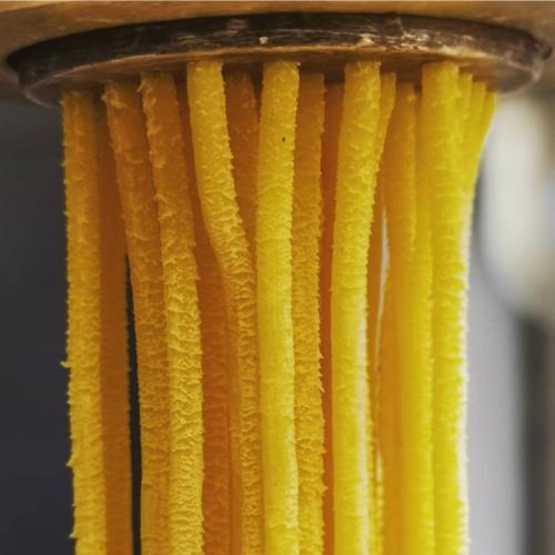 a bunch of yellow cords hanging from a pole at Locanda al Convento in Favaro Veneto