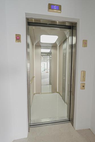 a glass elevator door in a building at Tawila Island Resort in Hurghada
