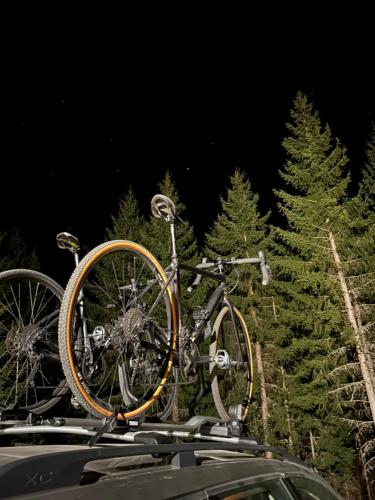 a bike is on the roof of a car at Guest House Golijski Dar in Dajići