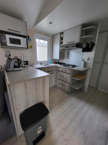 a kitchen with a sink and a counter top at La Carabasse-Vias "Te Mahana" in Vias