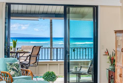 a living room with a view of the ocean at Kahana Village 2 · KHV 2 Direct Oceanfront 2BD Condo Steps to Be in Kahana