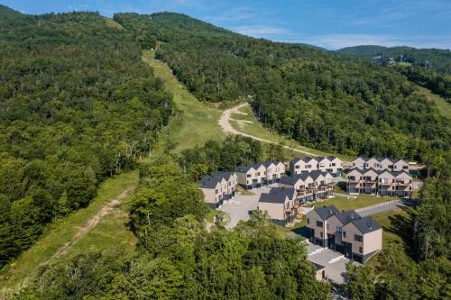 an aerial view of a resort in the mountains at Chalets Grande-Pointe au Massif de Charlevoix -Vélos - Rando -ski-in ski-out in Petite-Rivière-Saint-François