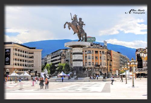 a statue of a man on a horse in a city at FREE PARKING City Square Vanilla Apart-Hotel in Skopje