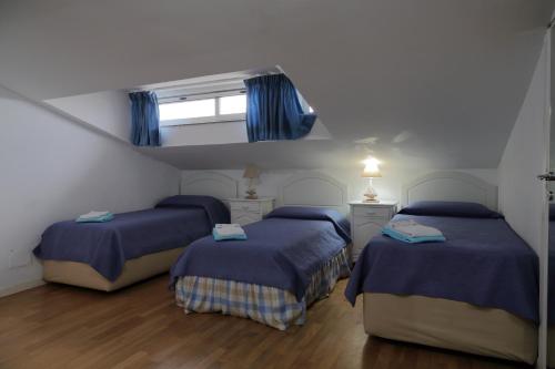 Ένα ή περισσότερα κρεβάτια σε δωμάτιο στο Villa con giardino a pochi passi dal mare