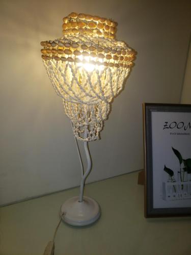 a lamp that is sitting next to a picture at Shanti Loft in San Juan
