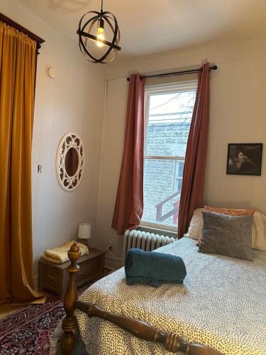 a bedroom with a bed and a window at Friendly Abbey Road Retreat in Berwyn