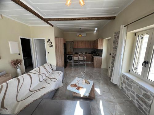 a living room with two couches and a table at Mythic Gem in Vathi, Ithaka