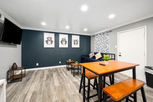 a living room with a table and a couch at Quirky & Chic 1BR Near Montrose & River Oaks! in Houston