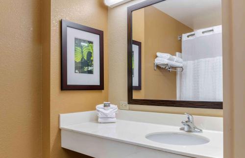 a bathroom with a sink and a large mirror at Extended Stay America Suites - Columbus - NE - I-270 in Gahanna